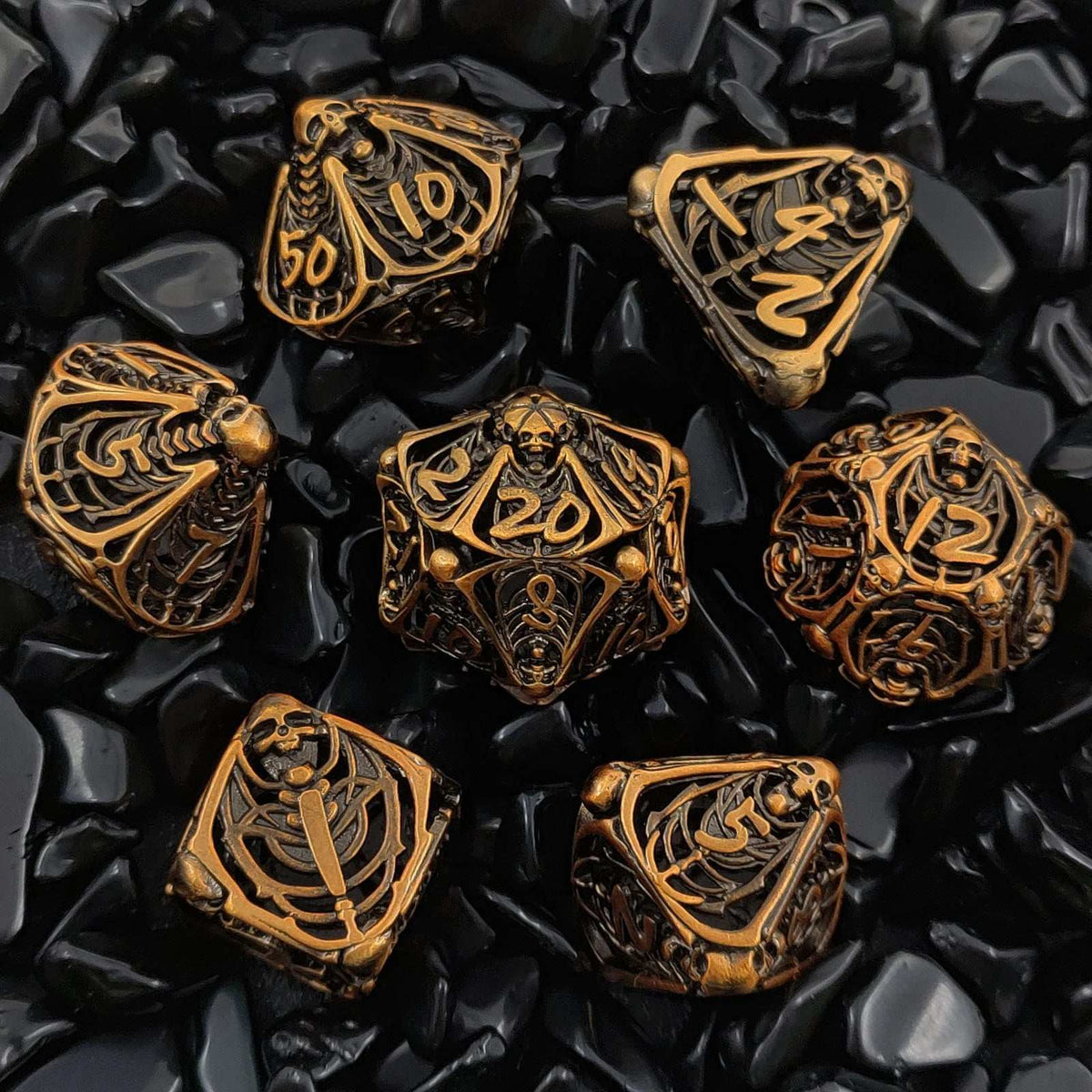 Hollow metal dice set with openwork design
