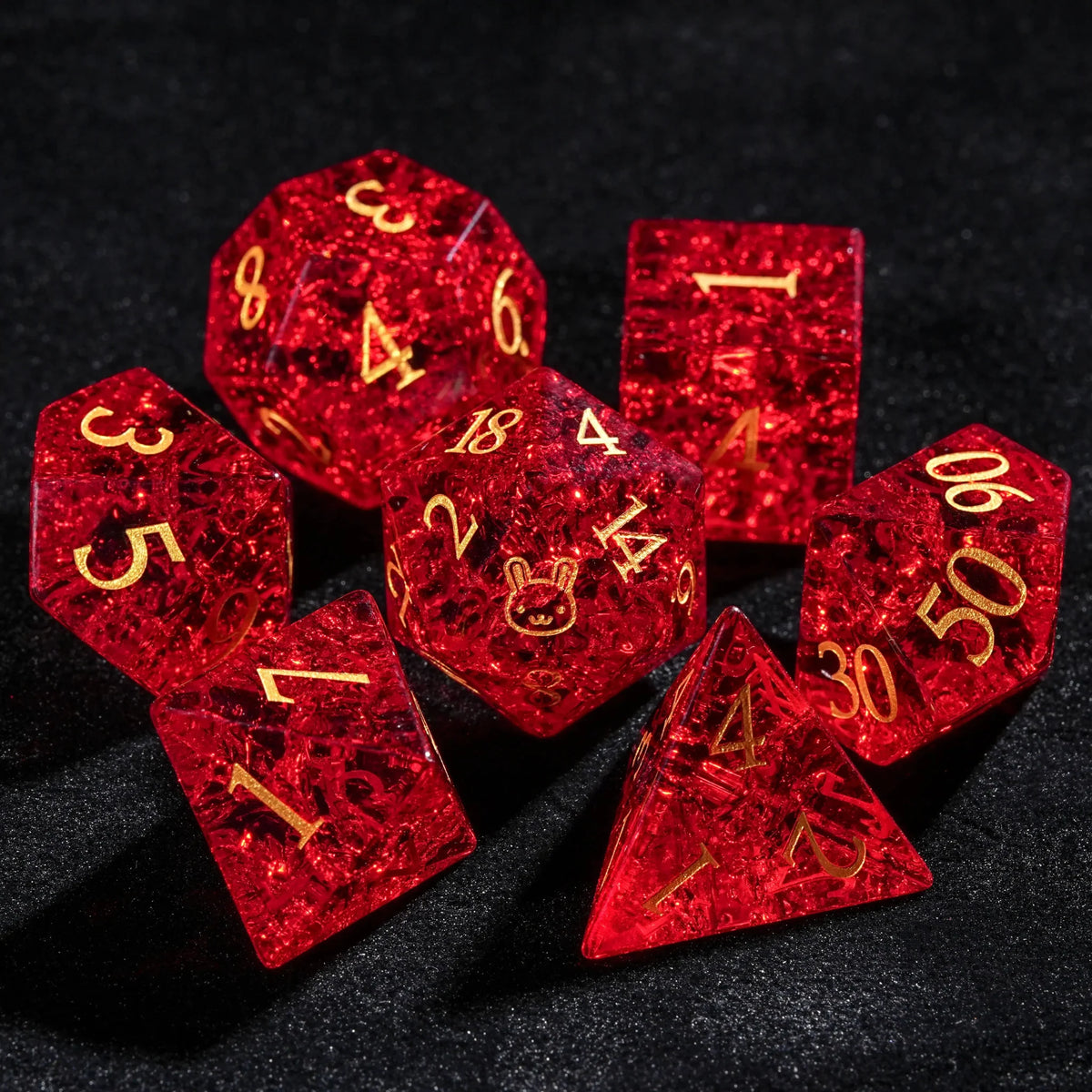 Burst Gem Gemstone DND Dice Set – Red glass DnD dice set with gold-engraved bunny design and numbers