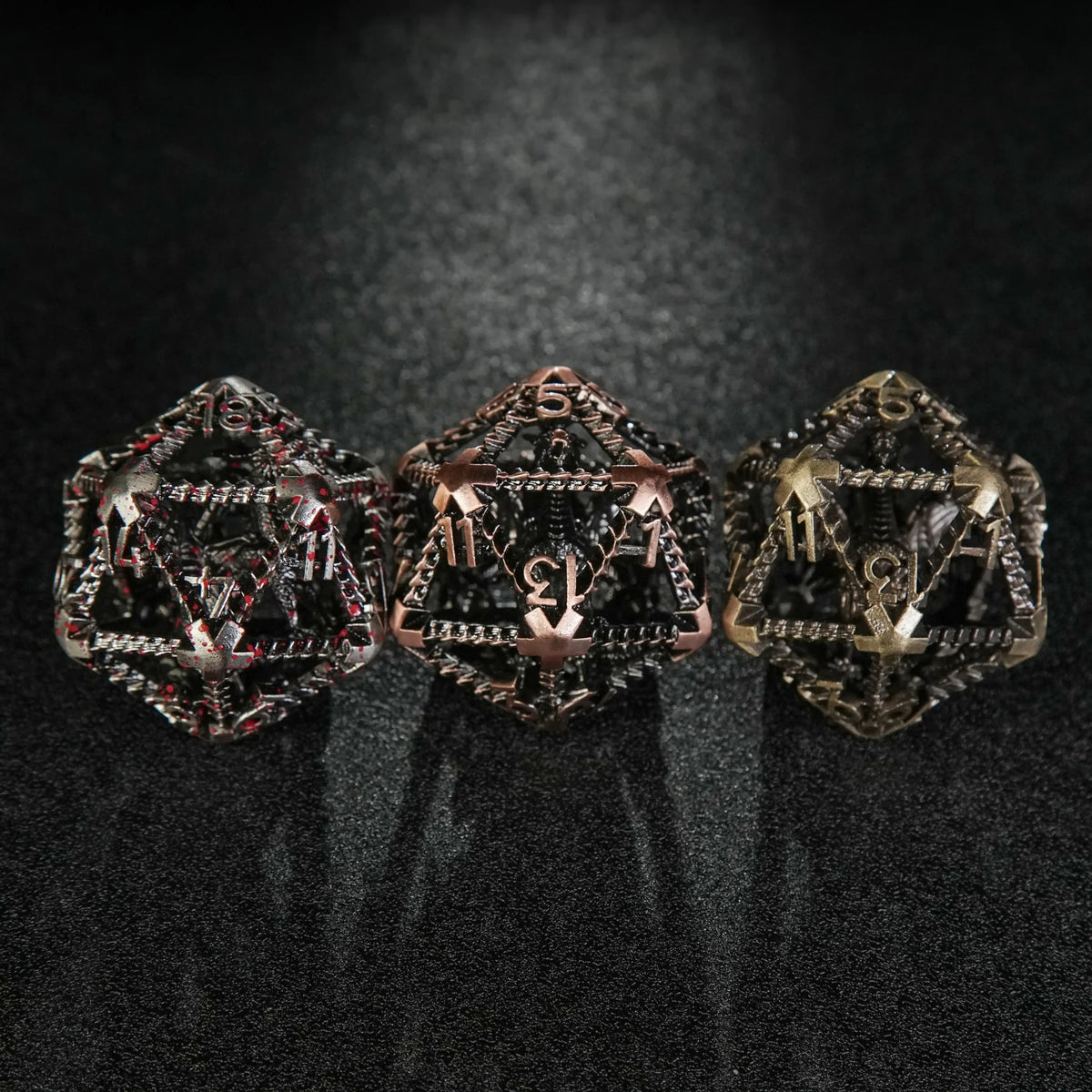Dragon Metal D20 Dice – Three giant 40mm metal hollow 3D dragon D20 dice (blood, copper, and bronze) arranged