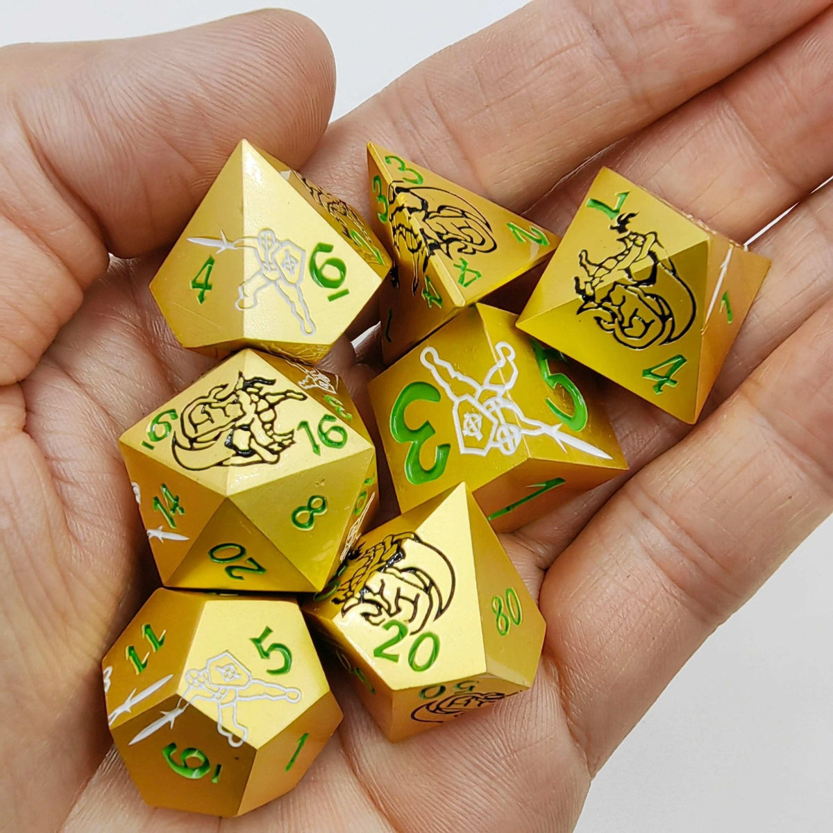 Dragon Metal DND Dice Set – Dazzling Warriors – Holding seven solid gold metal polyhedrons, the dice are engraved with
