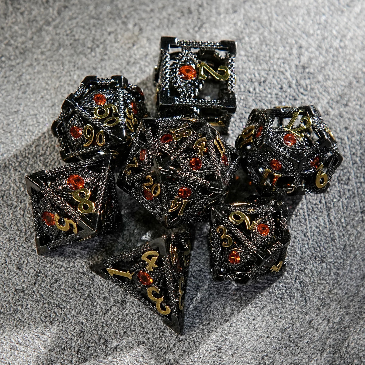 Dragon Metal DND Dice Set – Gold Numbers – Ruby Demon's Eye Black Metal Hollow DND Dice Set with Engraved Gold Numbers