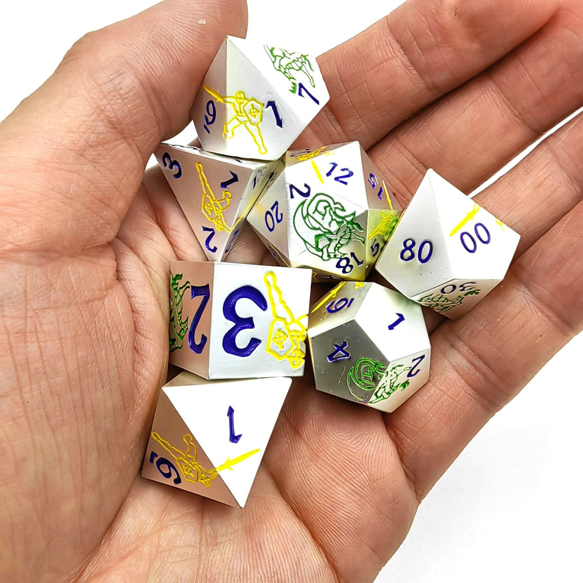 Dragon Warrior Metal DND Dice Set – Blue Numbers – White metal dice set with yellow warrior and green dragon + blue