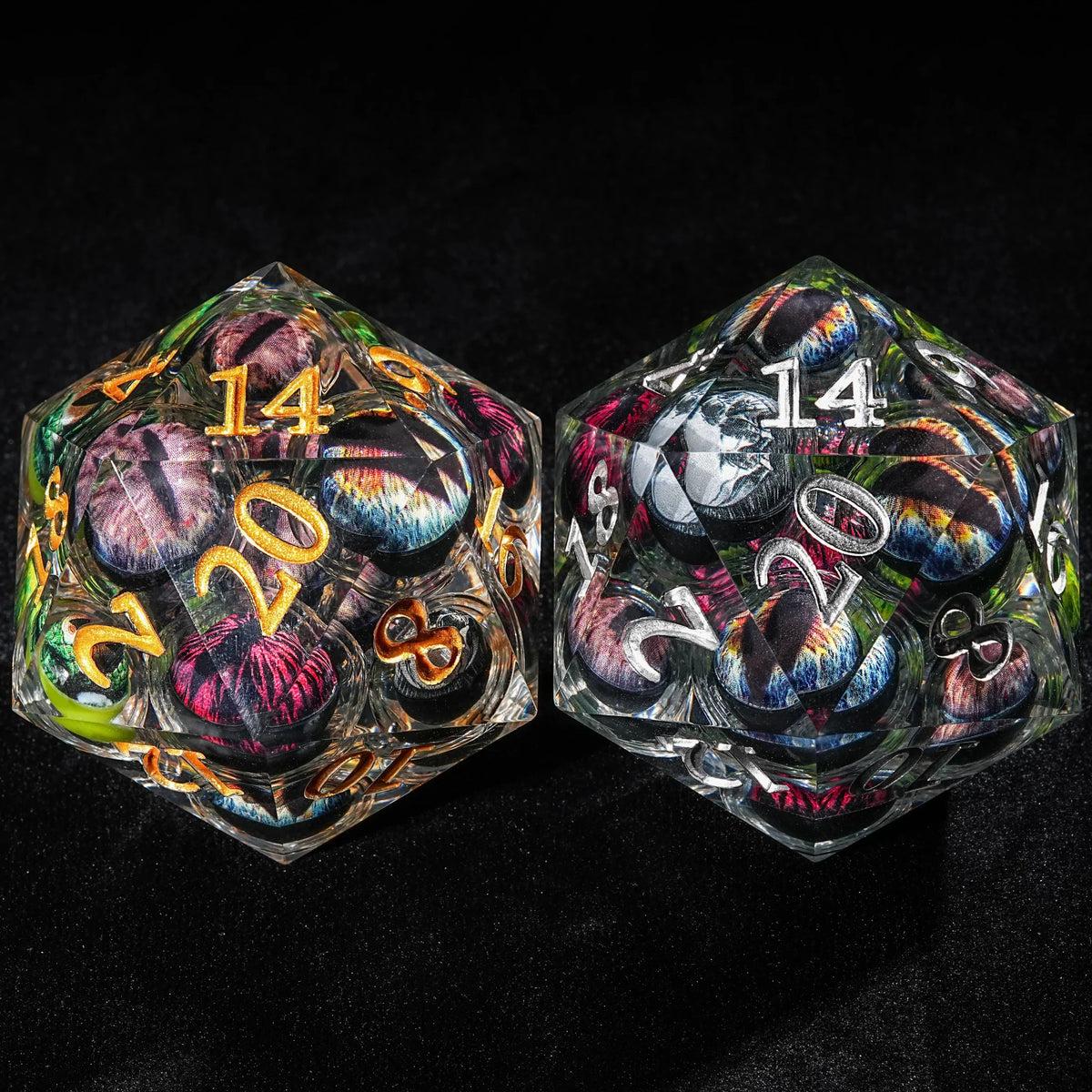 Eyeball Liquid Core Dice Set – Two 50mm diameter D20 Eye of Odin dice sit side by side on a table. One large D20 has