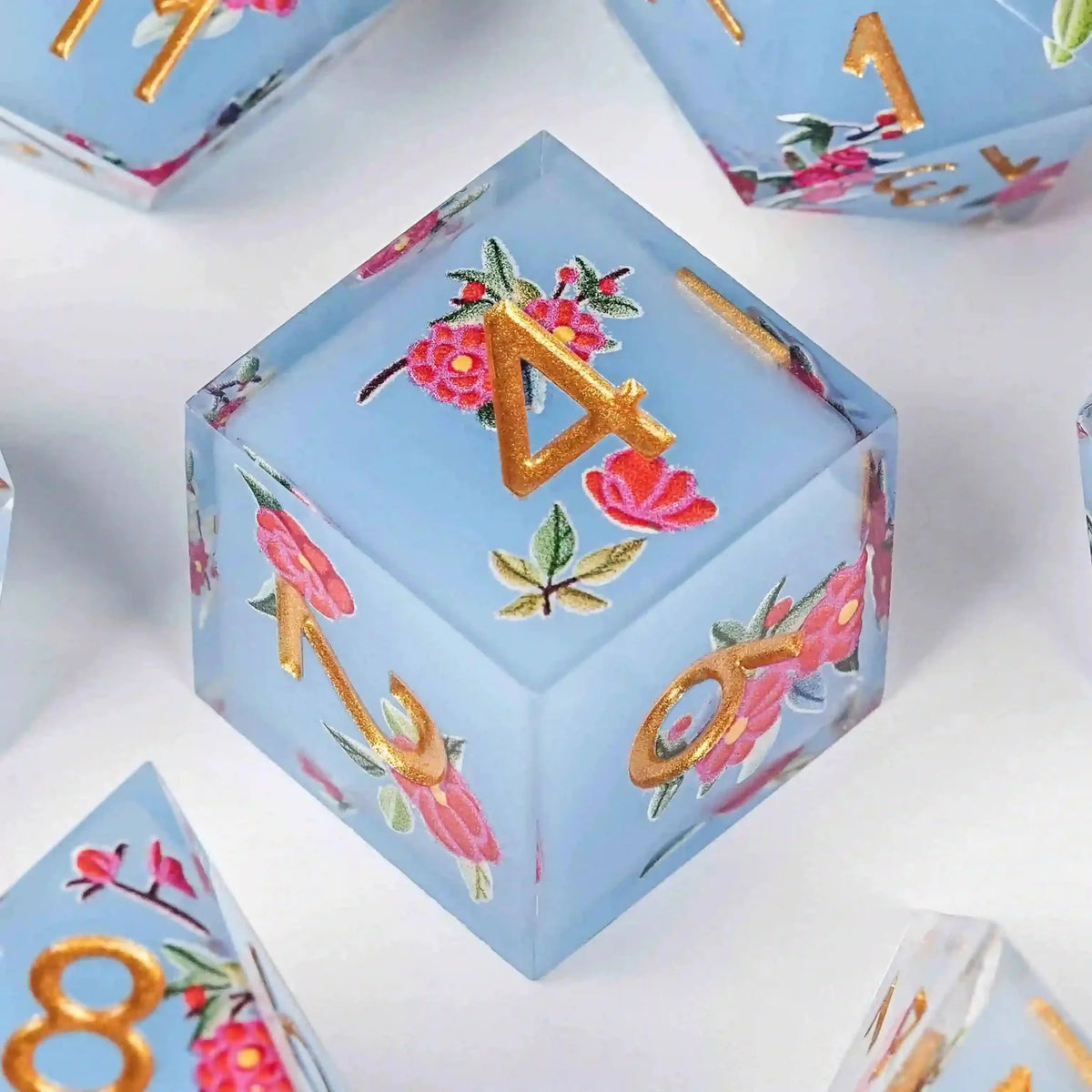 Flower Resin DND Dice Set – Gold Numbers – Light Light – DND D6 dice with light blue transparent resin and light red