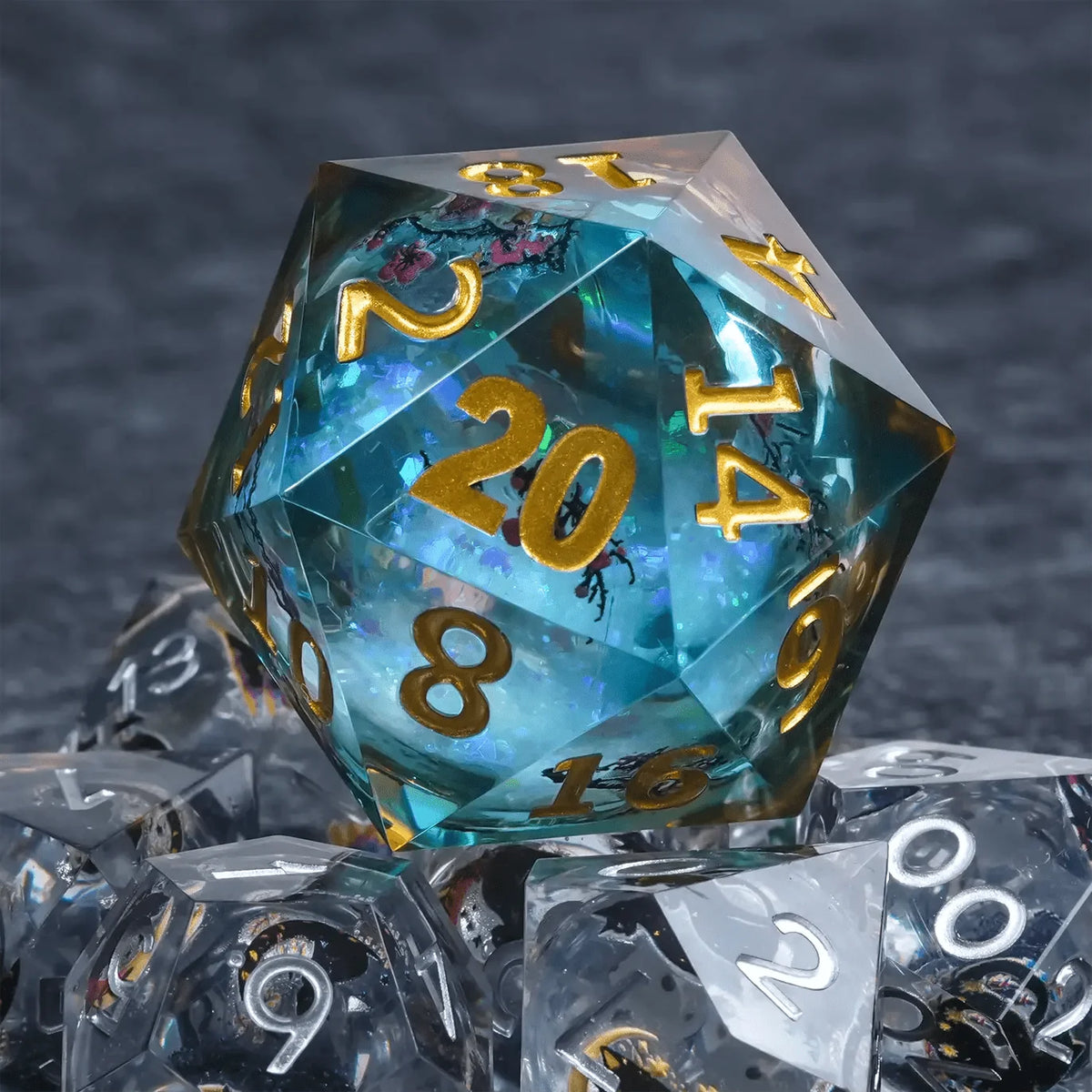 Giant Plum Resin D20 Dice – 35mm Sakura Blue Glitter Liquid Core D20 Dice with Gold Engraved Numbers Stacked on Seven
