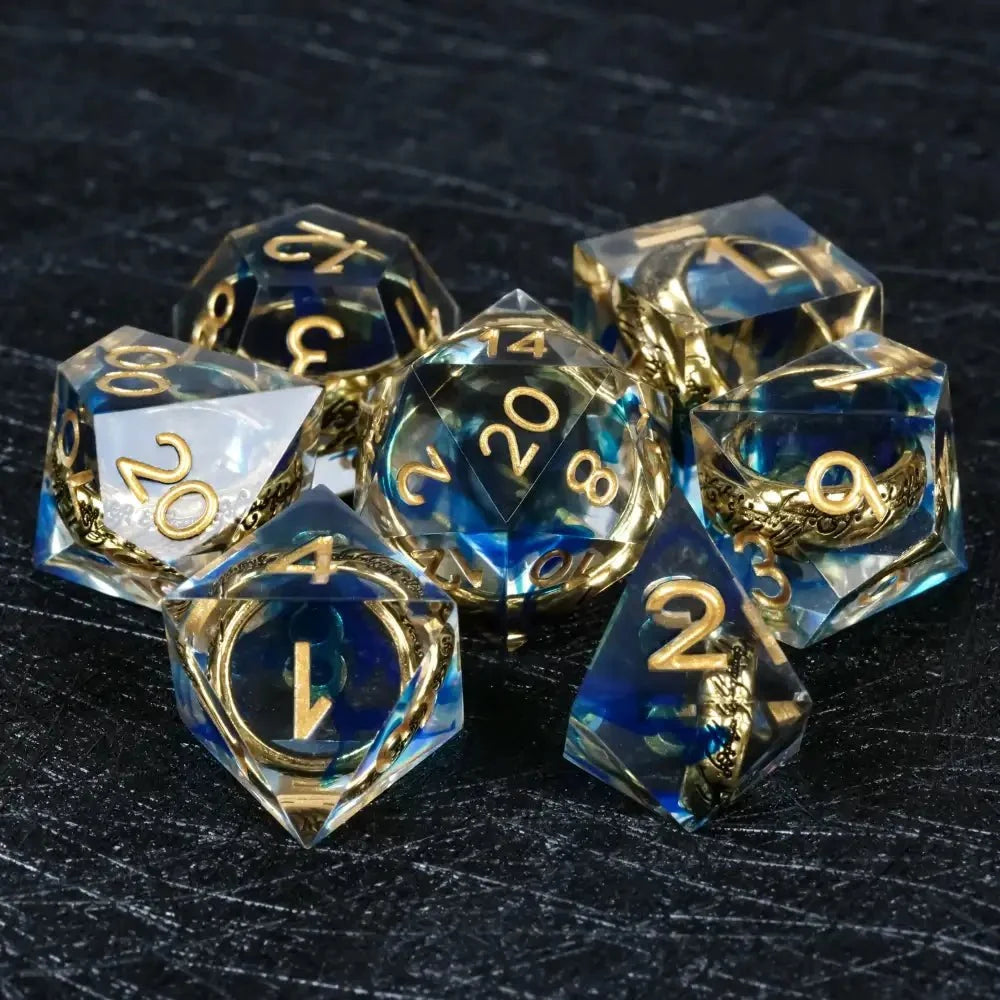 Gold Ring Resin Sharp Edge Dice Set – A set of sharp-edged blue transparent resin DND dice, including an engraved gold