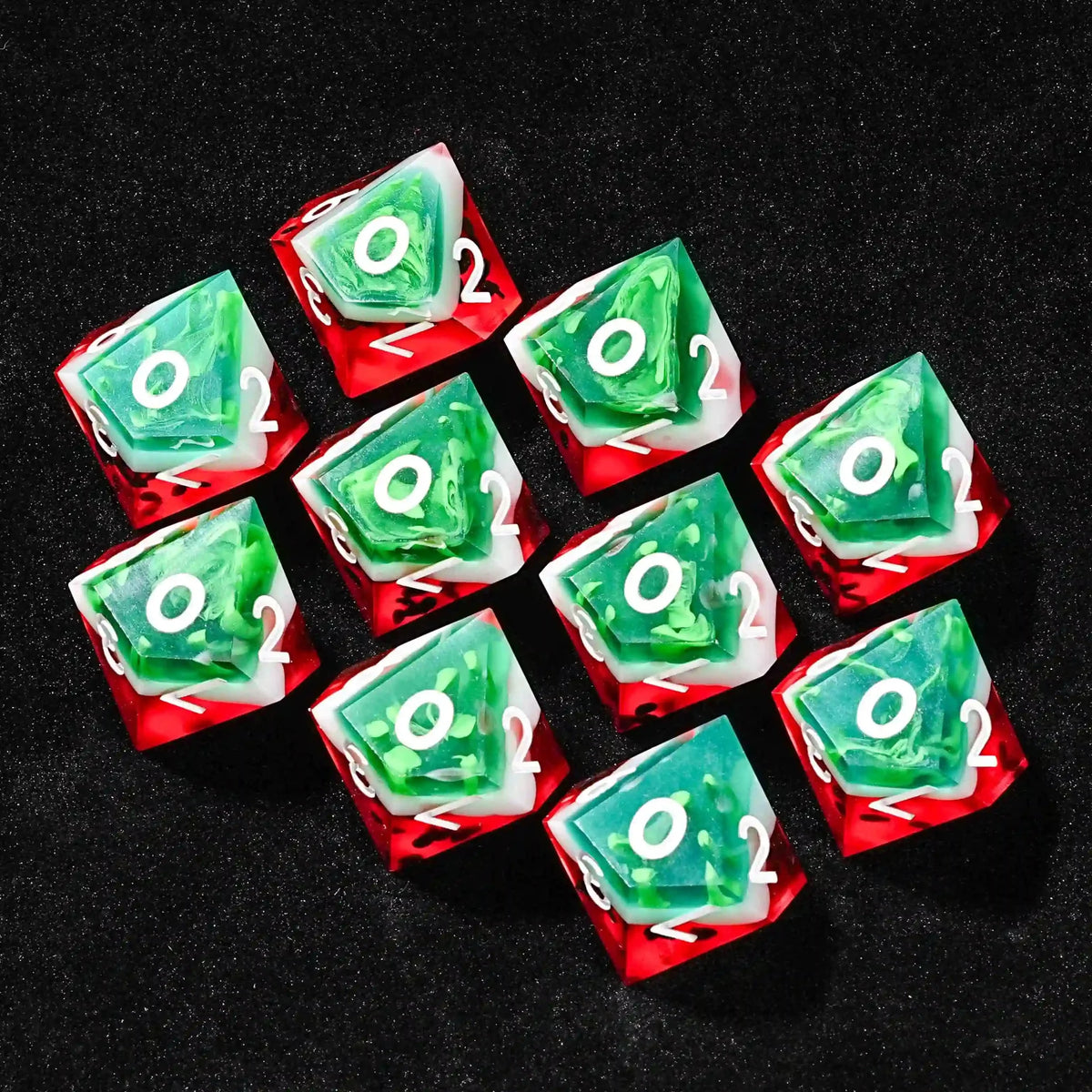 Juicy Watermelon Resin D10 Dice – Ten watermelon D10 dice neatly arranged on the table, with the white number 0 facing