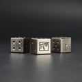 Metal D6 Dice Set – Warhammer 40K – Metal Warhammer 40K D6 Dice two dice close-up showing engraved faction emblem on