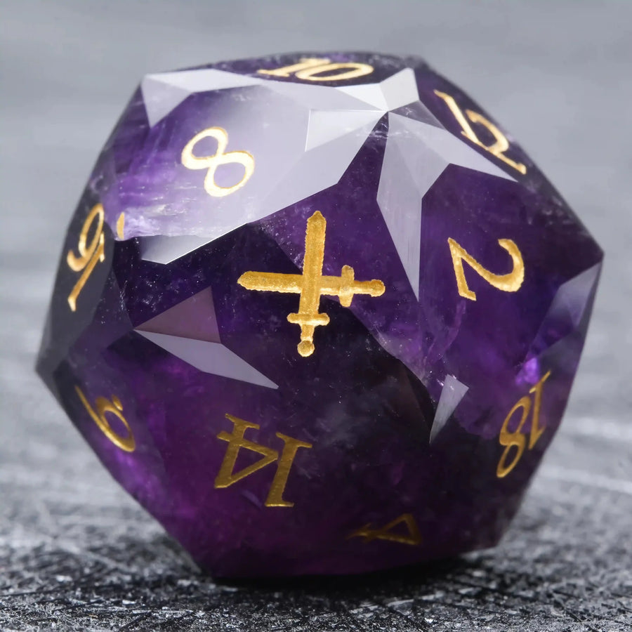 Multi Sided Natural Stone D&D Dice Set – The facet of this multi-faceted natural amethyst D20 die is engraved with a