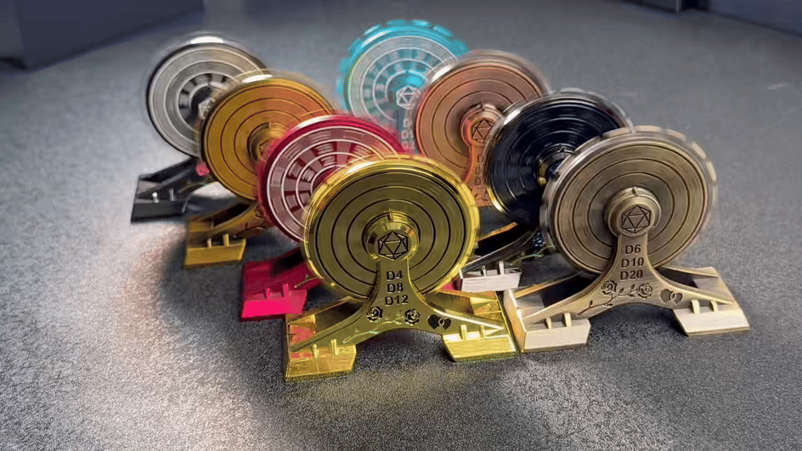 Rose Ferris Metal Spinner Dice Set – 8 different colored Ferris wheel dice spinners arranged in two rows are spinning