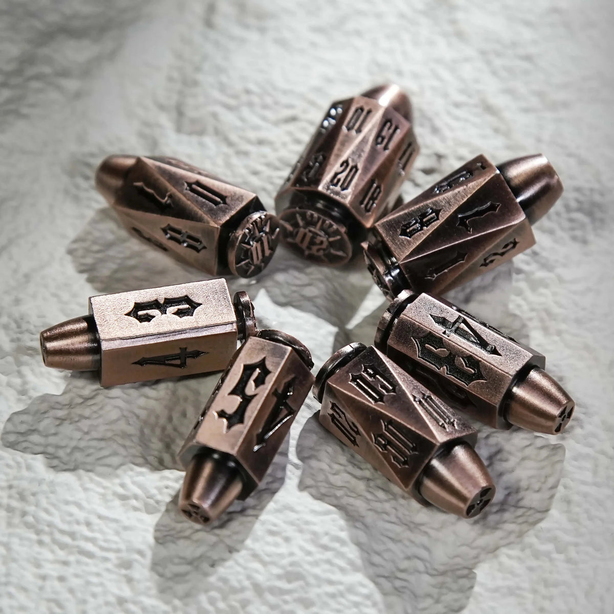 Shaped Polyhedron Metal Bullet Dice Set – Cool DND Dice Set: Copper Polyhedron Metal Bullet Dice arranged in a circle