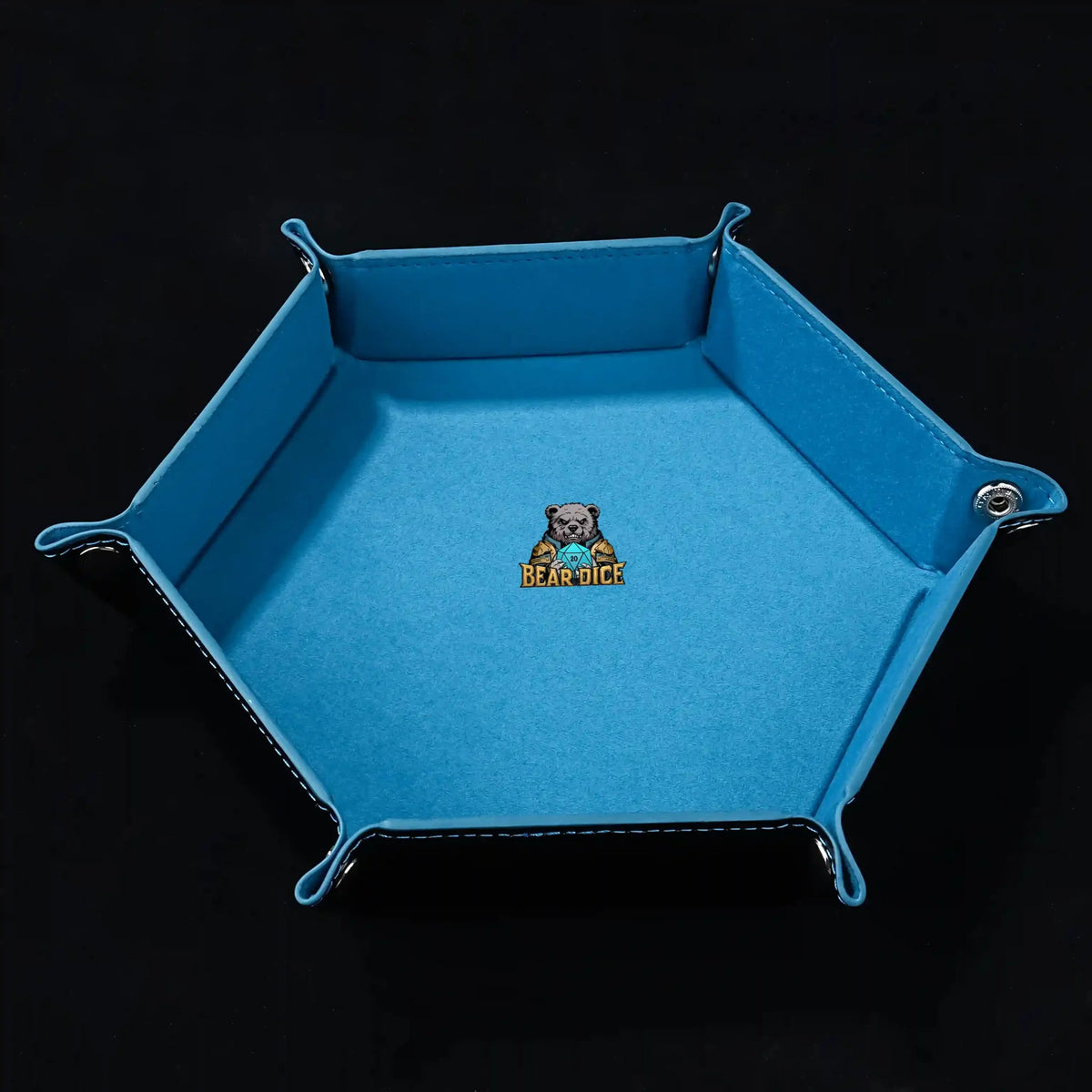 Snap Dice Tray – Leather – Hexagonal black PU leather RPG dice tray with silver buttons. Sky blue lining with the logo