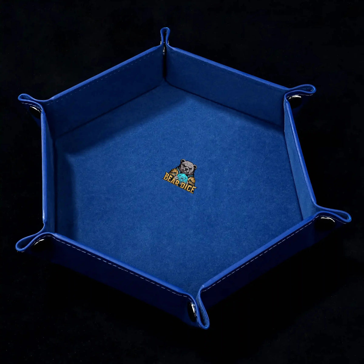 Snap Dice Tray – Leather – Hexagonal black PU leather RPG dice tray with silver buttons. Royal blue lining with the