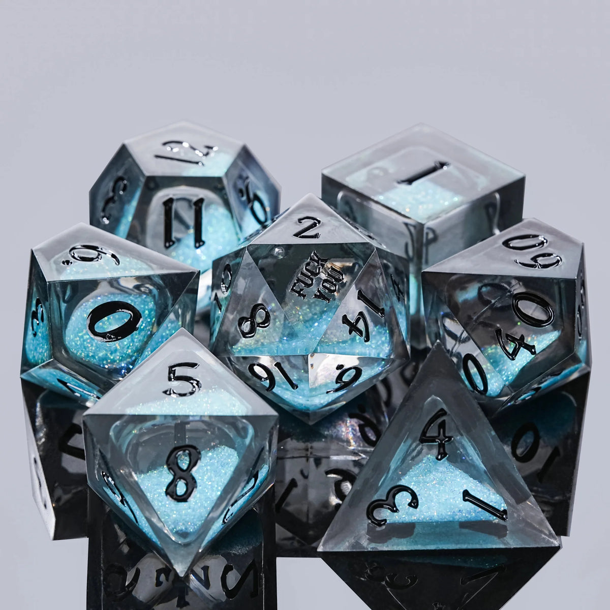 Wedding Liquid Core Dice Set – Blue liquid resin DND dice set, with the words "FUCK YOU" engraved on the face of the