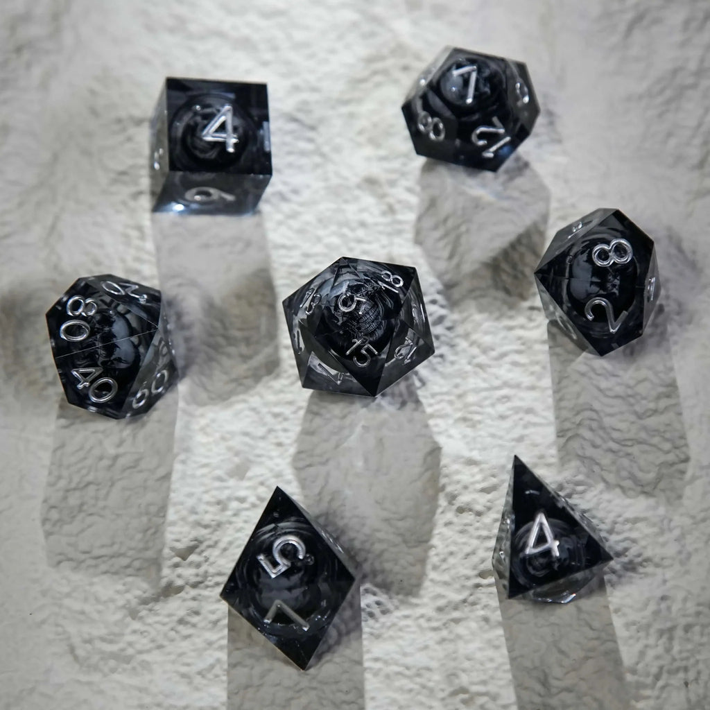 Wizard Liquid Core Dice Set – Dark Sorcerer's Skull Frame Liquid Core Resin Dice Set Silver Font