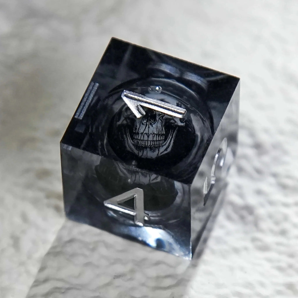 Wizard Liquid Core Dice Set – Dark Sorcerer's Skull Frame Liquid Core Resin Dice Set Silver Font